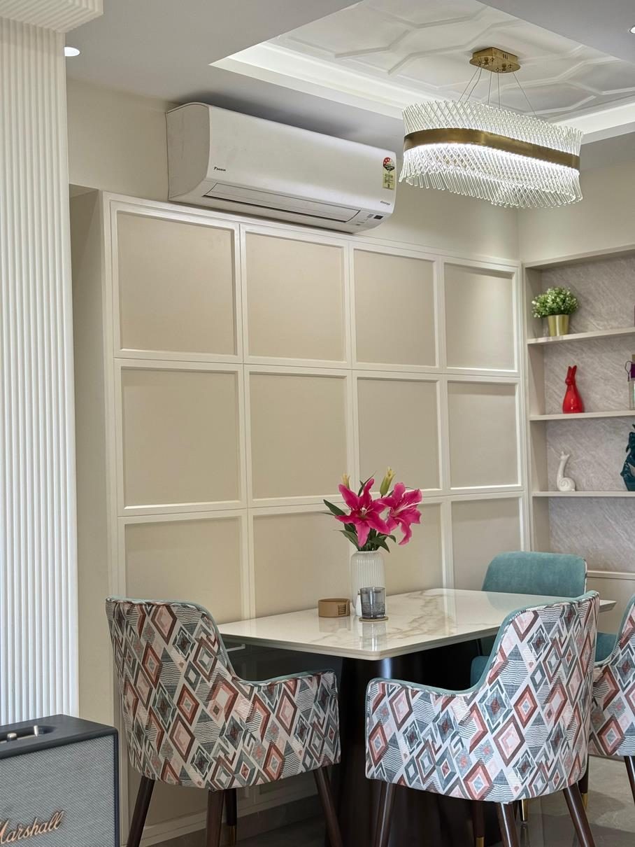 Warm residential interior with panelled walls and brass detailing — interior design in Navi Mumbai by Urbanwall.
